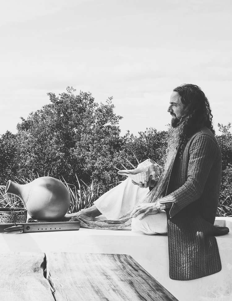 Nacho Arimany seated among natural percussion instruments